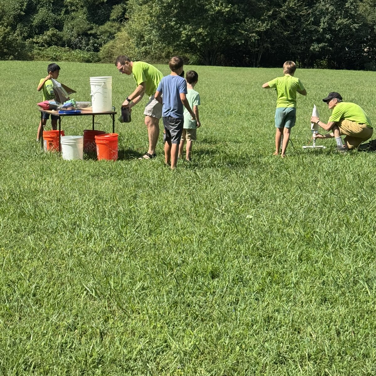 Pack 199 scouts launching rockets during a field activity.